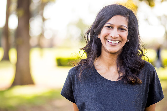 smiling woman in a park