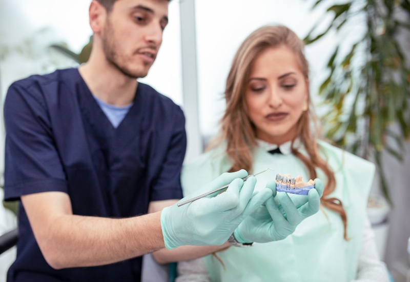 Dentist Guiding a Patient for a Perfect Denture in McAllen, TX